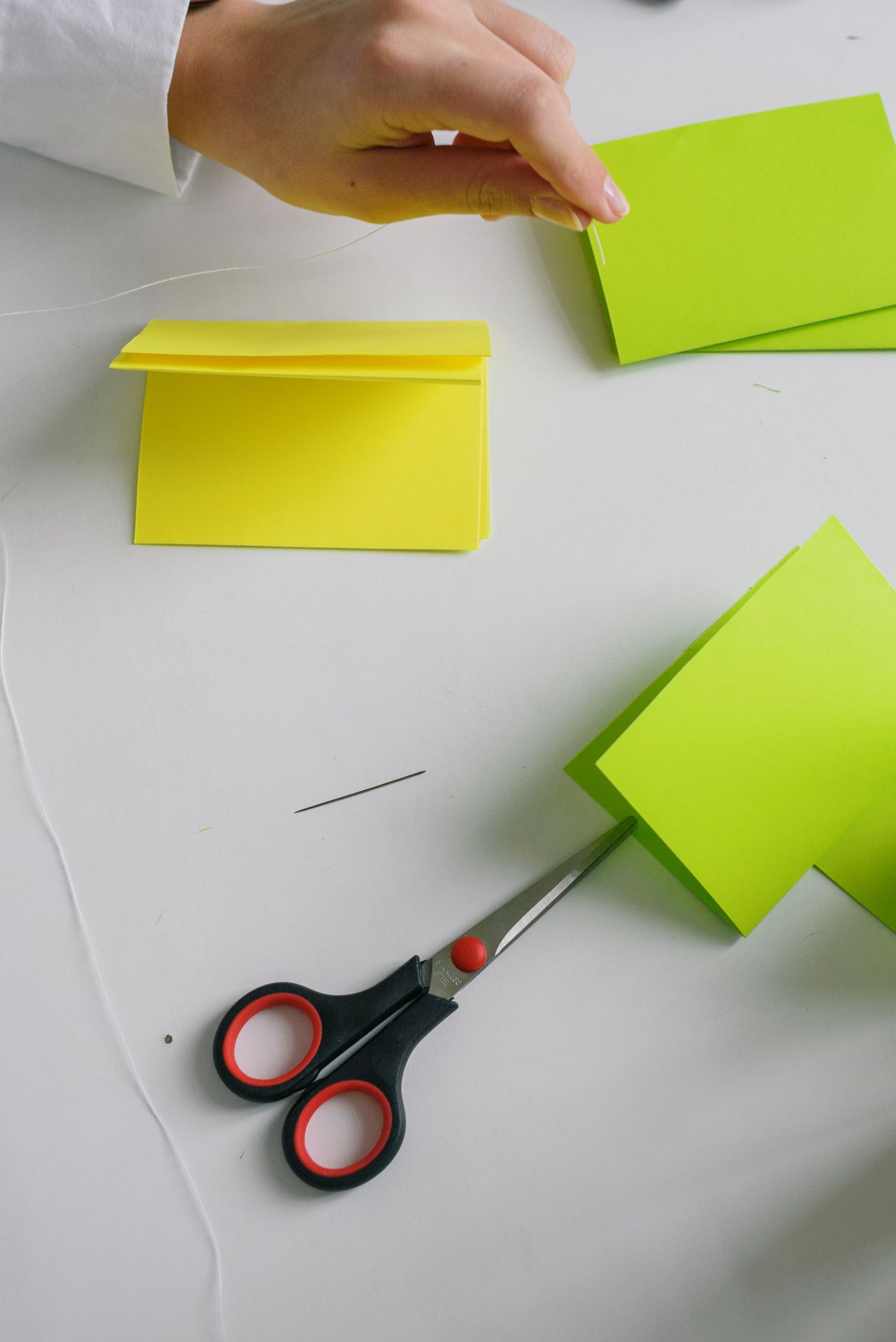 Colorful paper, scissors and craft supplies arranged for a children’s activity.